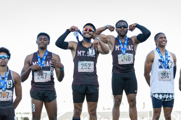 Mt. SAC's Caleb Harrell, Jake Jensen and state champion Asani Hampton showcase their medals on the podium after the men's 100-meter dash on Saturday, May 18 at the CCCAA track and field state championship at Saddleback College. (Greg Fontanilla | The Union)