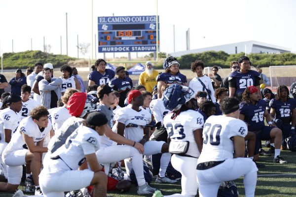 El Camino College football players gather around before the start of their spring football game on Wednesday, May 29 at Featherstone Field.