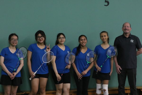 The El Camino Womens Badminton team smiles for the camera on a match day against San Diego Mesa College on Wednesday, April 17 at the Manhattan Beach Volleyball Club. From left, Mai Hoang, Anh Ly, Saray Kilos Gatica, Sabina Villa, Anya Gore and coach David Levin. (Renzo Arnazzi | The Union)