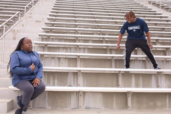 Sharonda Barksdale and Chance Williams on the Murdock Stadium Bleachers on April 26. (Delfino Camacho | The Union)