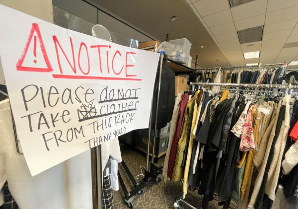 A hand-written sign advises workers not to remove clothing from a certain rack inside the Basic Needs Center back room on April 23. The center receives an impressive amount of clothing and food donation thanks in part to Barksdale's and teams connections. (Delfino Camacho | Warrior Life)