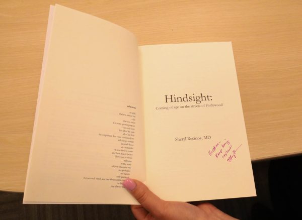 Kristina Martinez shows off the personalized note on the copy of the book Hindsight that was gifted to her by Sharonda Barksdale. The note reads "Kristina-- Keep being resistant." (Delfino Camacho | Warrior Life)