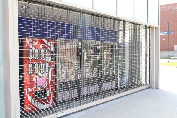 Vending machines on the side of Café Camino on are seen locked up and out of use on March 21. (Miliana Cienfuegos | The Union)