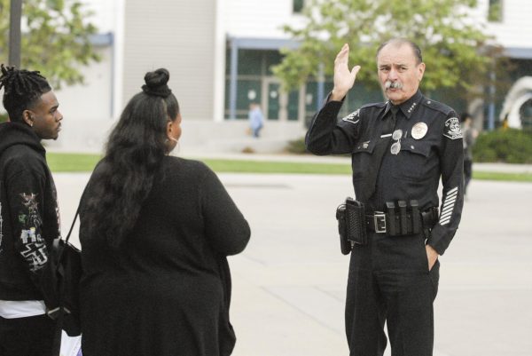 Campus Police Chief Michael Trevis greets visitors to El Camino College during the Career and Transfer Decision Day event hosted by the Associated Students Organization. (Clarence "Slihm" Davis | The Union)