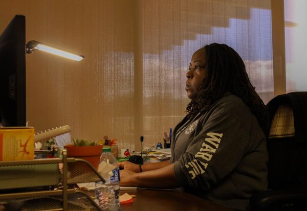 El Camino College Basic Needs Coordinator Sharonda Barksdale busy answering emails while in her office located inside the Basic Needs Center during a busy morning on Thursday, March 7. Barksdale oversees the Basic Needs Center, located above the Bookstore the center offers clothing, food, transportation and more to students and community members in need. (Delfino Camacho | The Union)