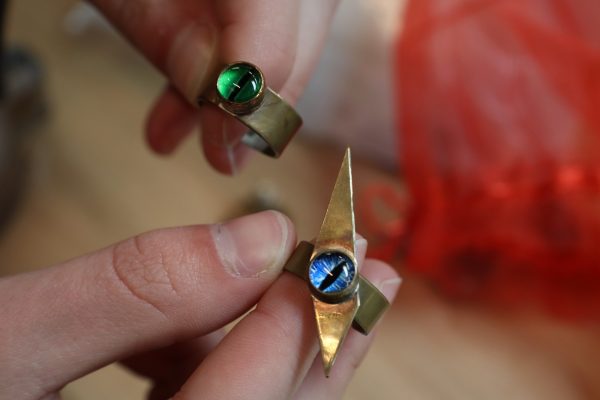 Studio Arts major, Liam Messer, showcases the rings he created on Friday, March 29 at El Camino College. He asserts he created these rings with metal, resin, and paper. (Jamila Zaki | Warrior Life)