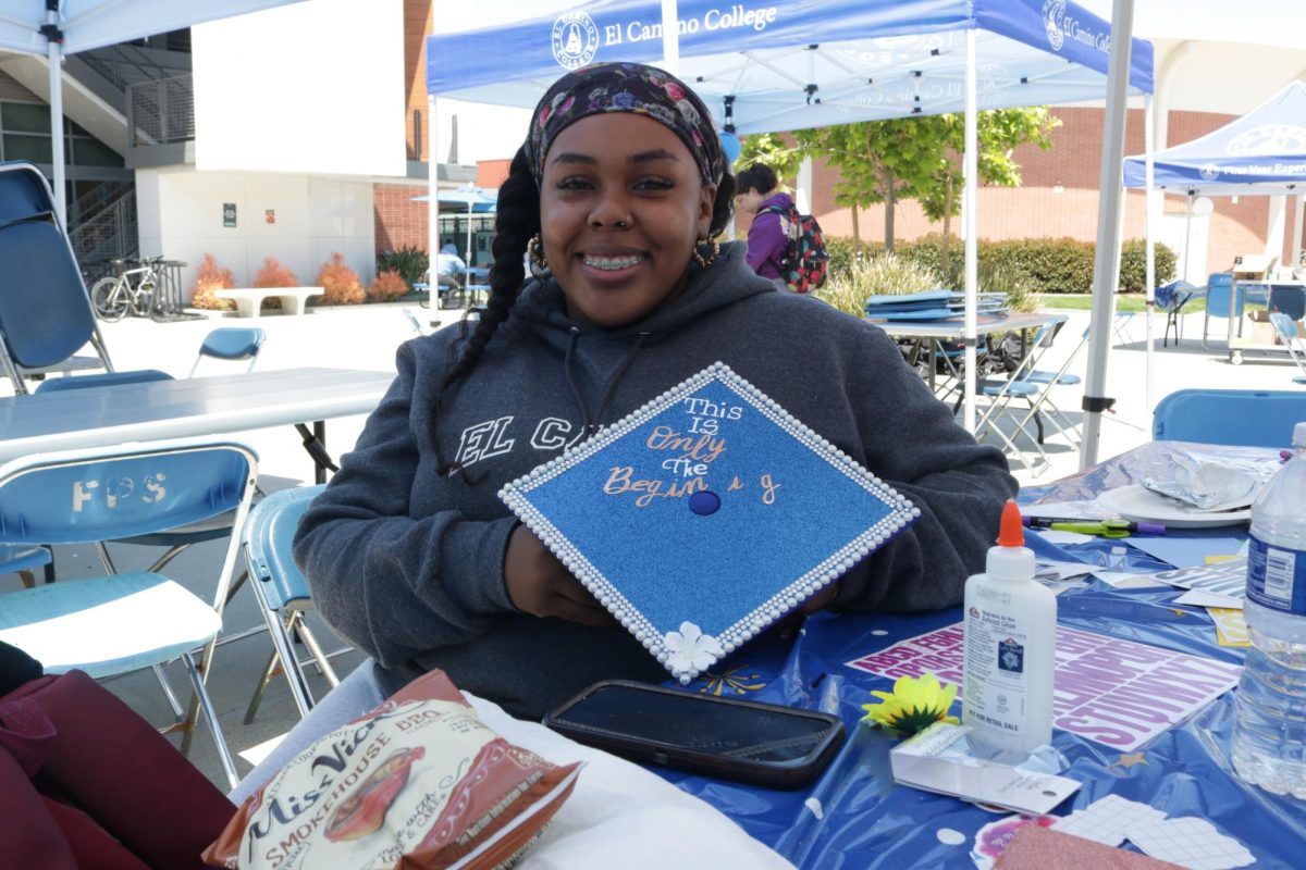 Psychology major Roshumba Mason, 32, designs her graduation cap on May 29, 2024 at the Grad Cap Decorating Event in the Student Services Plaza. I am transferring to UCLA after having returned to El Camino College in 2021, Mason said. (Joseph Ramirez | The Union)