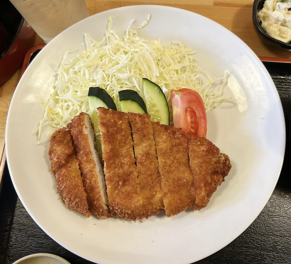 Kotohira’s take on chicken katsu. A couple of cucumbers and a slice of tomato to complement the chicken on the plate as well. (Tommy Kallman | Warrior Life)