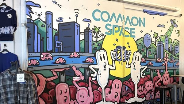 One of Common Spaces many murals invites guests to come in and have a pint with friends on Friday, April 19. The Hawthorne-based brewery strives to create an inclusive place where sports fans can catch up on the latest games. (Erica Lee | The Union)