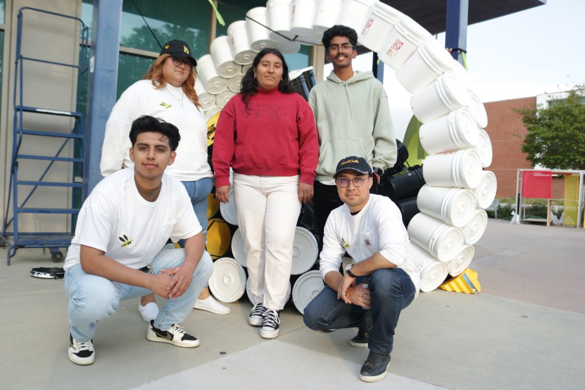 El+Camino+College+architecture+students%2C+from+top+left%2C+Juliana+Valenzuela%2C+Marlene+Ruiz%2C+Sumit+Sunampally%2C+Oben+Duran+and+Michael+Lamberd+display+their+beehive+module+made+of+buckets+and+tied+together+with+velcro+on+Wednesday%2C+May+15.+%28Joseph+Ramirez+%7C+The+Union%29