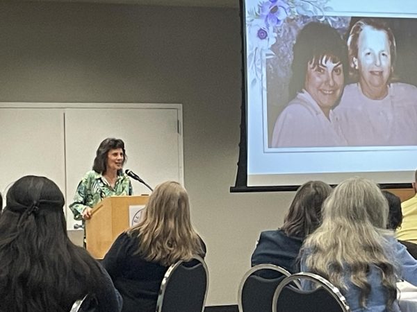 El Camino College psychology professor Angela Simon leads the celebration of life of Gloria E. Miranda in the East Dining Room on Wednesday, May 8. “It’s okay to be sad,” she said. “We’re here to show love.” (Erica Lee | The Union)