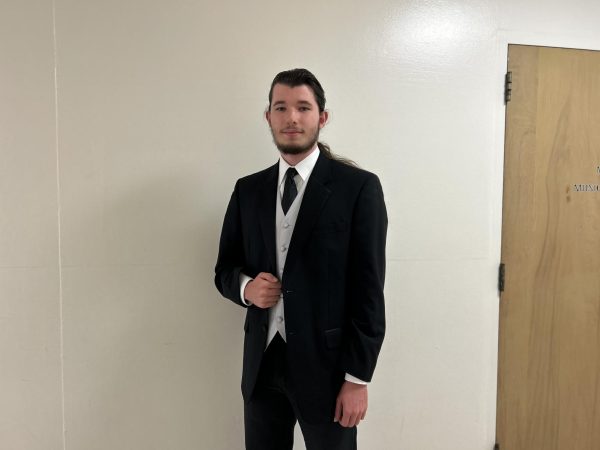 Society of Music club president Alexander Nunley poses outside of their meeting room on Thursday, May 16.