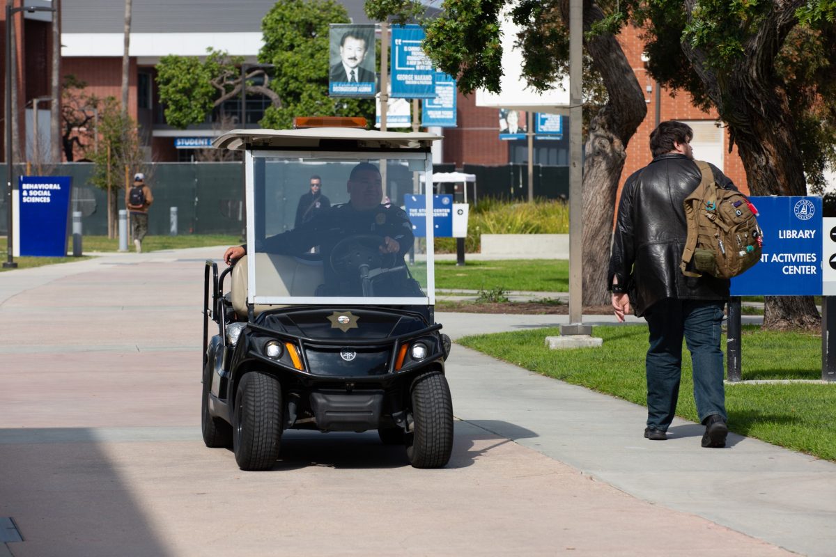El Camino College Sergeant Ruben Lopez patrols the campus in a police electric cart at El Camino College on February 14, 2024. Lopez earned around $204,000 in 2022. (Raphael Richardson | The Union)
