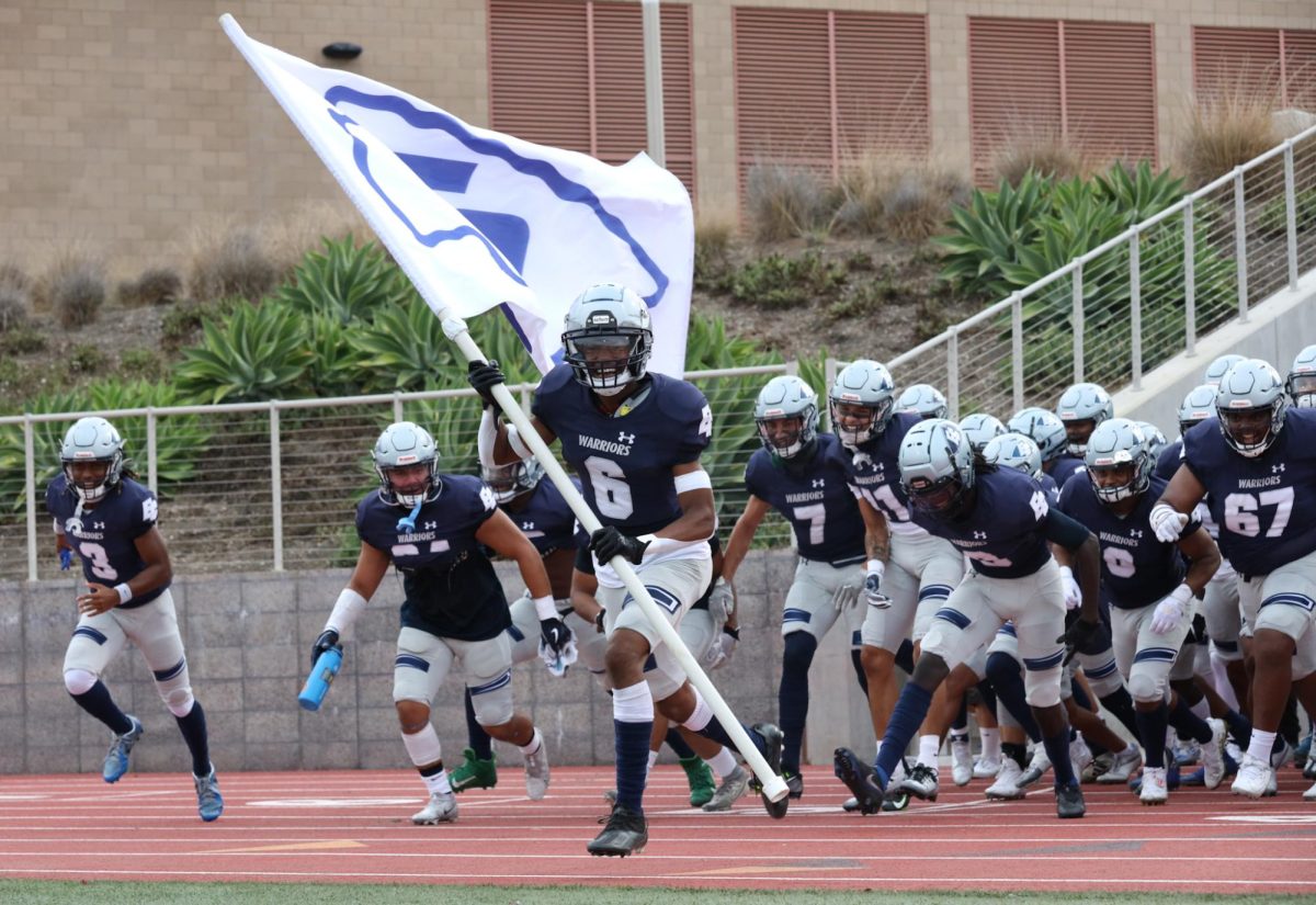 El Camino College Warriors run out of the tunnel to take the field for their game against Bakersfield on Saturday, September 10, 2023, at Murdock Stadium. (Greg Fontanilla | The Union)