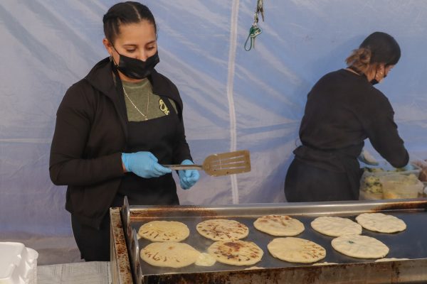 Women working at a food vendor, located on Crenshaw Boulevard and Marine Avenue wait patiently for the tortillas until they are ready to be flipped on Mar. 30. ( Miliana Cienfuegos | Warrior Life)