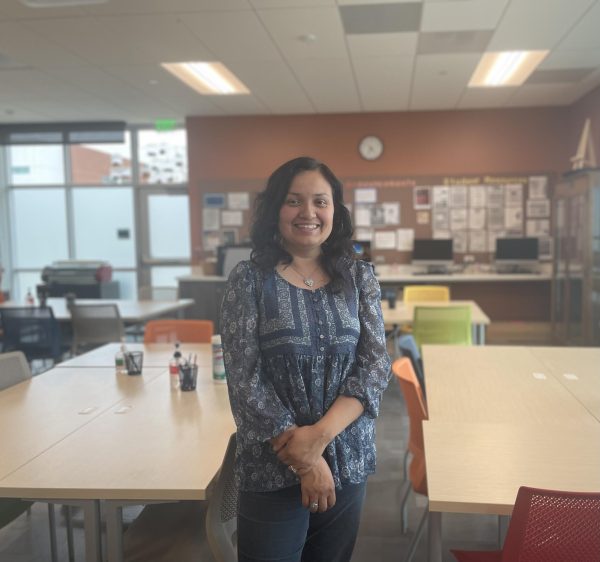 El Camino College associate professor of Childhood Education Cynthia Cervantes smiles for a photo inside the new Teacher’s Resource Room in the Behavioral and Social Sciences Building. The room is a place where students can work, study, and access resources. (Amanda Niebergall | The Union)