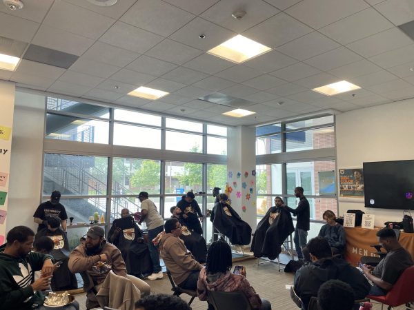 Students gathered in the SEA room at the Student Services building participate in the Dr. Parrish Geary’s Barbershop Talks event hosted by MOCAN on May 22. Photo by Joshua Flores