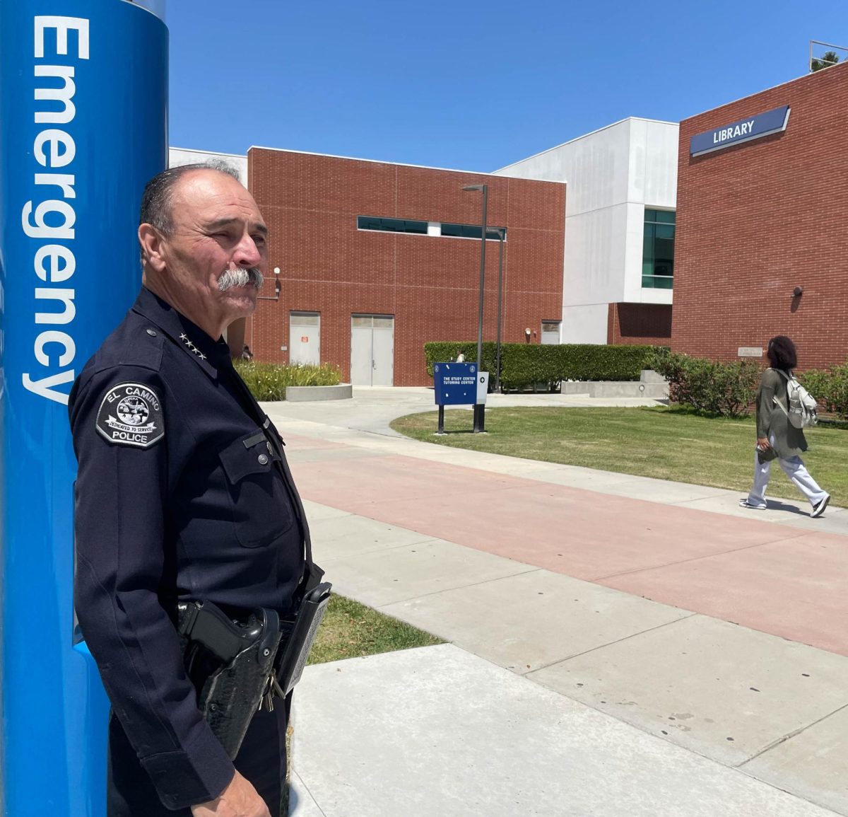 El Camino College Police Department Chief Michael Trevis leans against a more recently installed Blue Pole near the Behavioral and Social Sciences Building on Tuesday, April 30. (Joshua Flores | The Union)