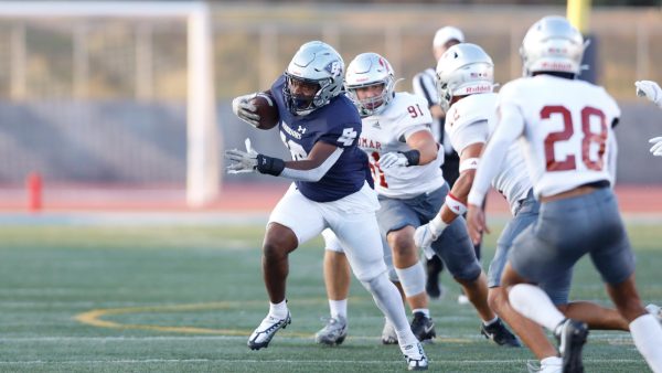 In its home opener on Saturday, Sept. 14 at Featherstone Field, a Warriors ball carrier finds a hole in the Comets' defense for a gain of positive yardage. The Warriors will look to bounce back in a Sept. 21 clash against the Riverside Tigers at Featherstone Field at 6 p.m. (Greg Fontanilla | The Union)