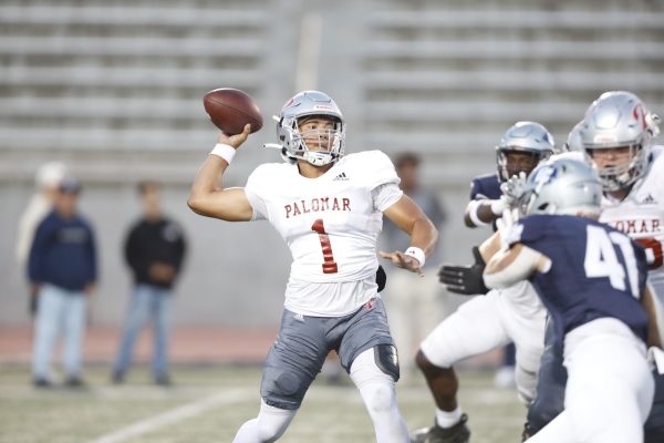 Palomar Comets quarterback KJ Chatham attempts a pass at Featherstone Field on Saturday, Sept. 14. Chatham and the Comets walked off the field with their first win of the season against the Warriors of El Camino. Chatham completed nine passes out of 23 attempts which included a touchdown pass to