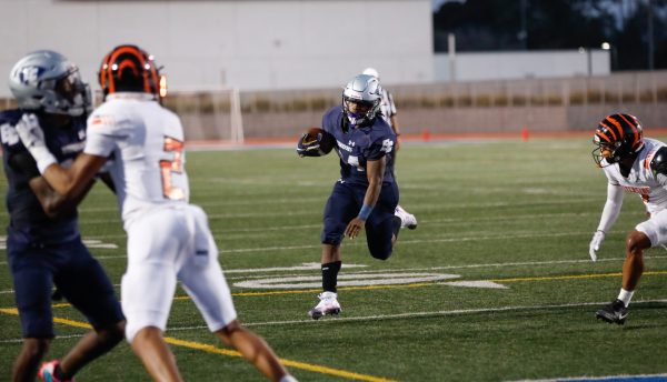 El Camino Warriors running back Zamir Hall runs attempts to zoom past the Riverside Tigers defense at Featherstone Field on Saturday, Sept. 21. The Warriors were overwhelmed by the Tigers 70-45. (Greg Fontanilla | The Union)