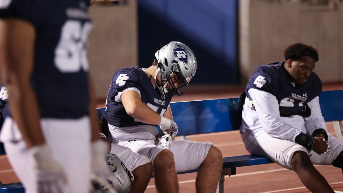 Warriors of El Camino sit in silence on a bench after dropping their season-opener to the Palomar Comets on Saturday, Sept. 14 at Featherstone Field. The Warriors will look to bounce back in a head-to-head clash with the Riverside Tigers on Saturday, Sept. 21 at 6 p.m. at Featherstone Field. (Greg Fontanilla | The Union)