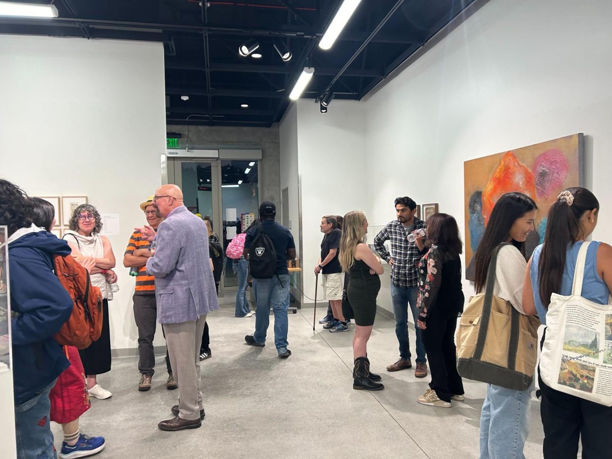 Spectators at the opening night reception for the Doodle and Dream art exhibition gathered at the El Camino Art Gallery on Sept. 5. The exhibition will last until Oct. 3. (Angel Pasillas | The Union)