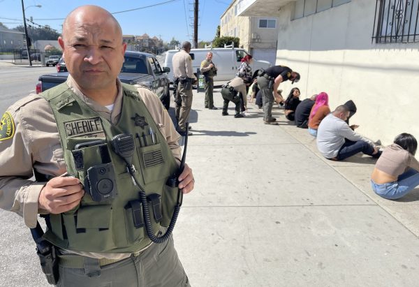 The Los Angeles County Sheriff's Department raids an unlicensed cannabis dispensary on Imperial Highway in South Central Los Angeles. Customers and workers say the underground economy will continue due to barriers that prevent participation in the licensed industry. (Kim McGill | The Union)