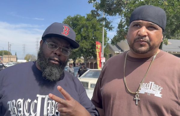 Jaime Gregory (right) and other members of Bacc II Bacc Car Club attend the Watts Life annual BBQ on March 17, 2024 on 103rd Street. Gregory dealt weed through high school in order to pay for his clothes, school supplies and transportation. “The government supplied the guns and drugs,” Gregory says. Gregory completed El Camino College courses while he was incarcerated on drug charges at Terminal Island. “With our parents struggling to keep a roof over our heads and the welfare system not providing the help that they should, kids were learning the drug trade and feeling that was the way out,” Gregory says.