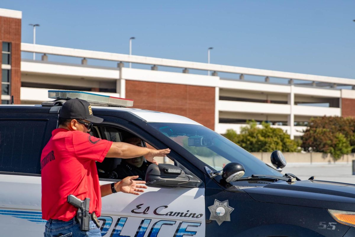 A driving instructor guides an El Camino College Police Department officer on how to maneuver through the driving course on Tuesday, Sept. 24. ECCPD partnered with the Gardena Police Department during the training exercise. (Kayla Mitchell | The Union)