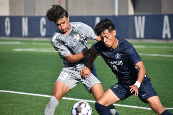 El Camino forward center Steven Alvarenga is defending the ball from Norco midfielder Andrew Garcia. (Elliott Bullock II) [The Union]