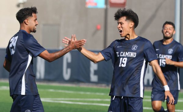 El Camino forward Steven Alvarenga (right) celebrates his goal with Marvin Gamez (left).  (Renzo Arnazzi | The Union}