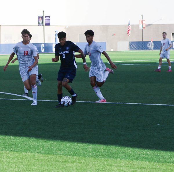 Warriors forward Alek Palomares swiftly dribbles between Comets Defenders to attempt a pass to his teammate for a simpler attempt on goal.(Renzo Arnazzi|The Union)