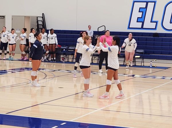 Warrior's show support toward eachother moving into the second set after winning 25-9 in the first set against the Cubs.