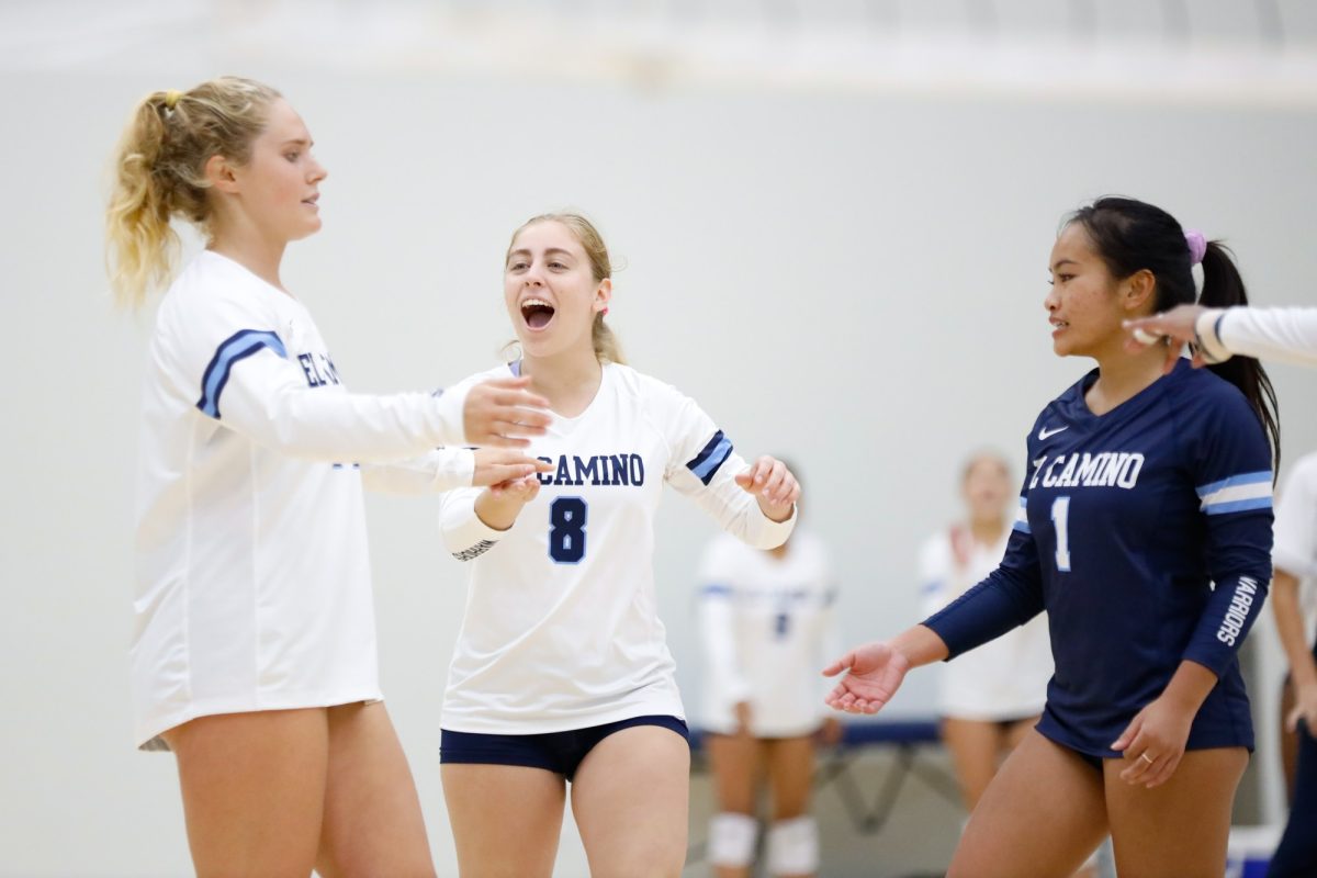 From left to right: Erica Griffiths, Alyssa Estrada and Maddie Gloria of the El Camino Warriors huddle together for a point celebration during a South Coast Conference showdown with LA Harbor on Friday, Oct. 11 at the ECC Gymnasium. El Camino swept LA Harbor 3-0. The Warriors next game will be on the road against Compton College on Friday, Oct. 18. (Greg Fontanilla | The Union)