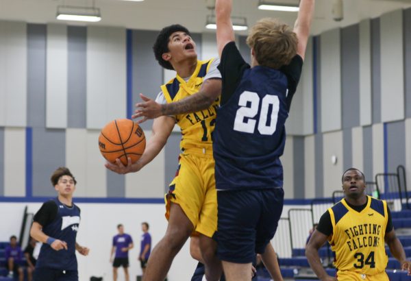 A Cal Miramar player attempts to shoot the ball during a scrimmage game on Oct 9. at the ECC Gymnasium. (Renzo Arnazzi |The Union)