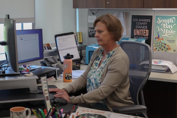 Ann O'Brien, El Camino College executive director of marketing and communications, works at her desk in the Administration Building on Monday, Sept. 30. (Eddy Cermeno | The Union)