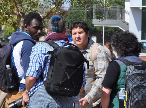 Mason Klekotka is confronted by supporters of the Palestine demonstration after his speech on Oct. 8.