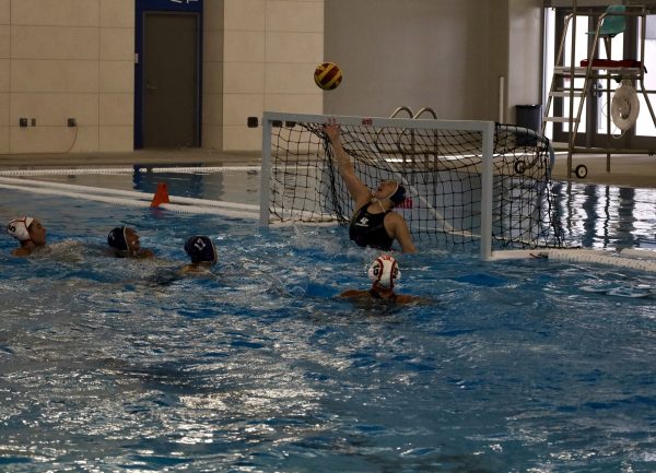 El Camino Warriors women's waterpolo goalie, Katrina Sanchez, attempts to intercept the ball from making it into the goal on Wednesday, Oct. 30, 2024