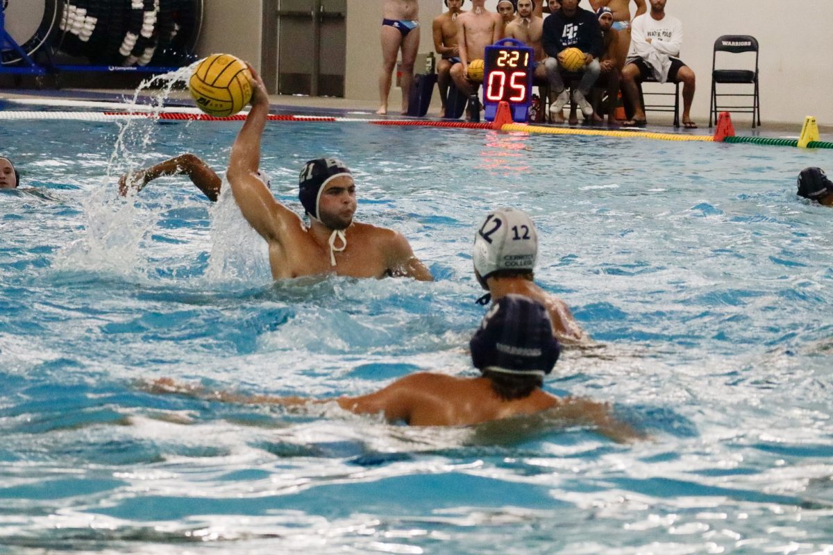 Attacker Max Hale prepares to serve the ball in the fourth period during a men's water polo game between the El Camino Warriors and Cerritos Falcons on Wednesday, Oct. 9. (Erica Lee | The Union)