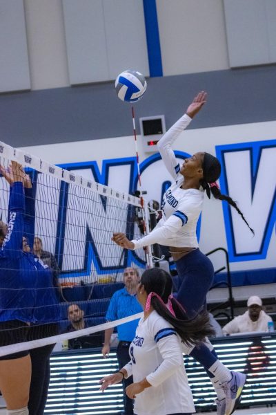 El Camino Warrior, Aireon Scott, jumps to block a ball from Cerritos. The game agaisnt Cerritos Falcons was held on Friday, Oct 4 in the ECC Gym Complex. . (Kayla Mitchell | The Union)