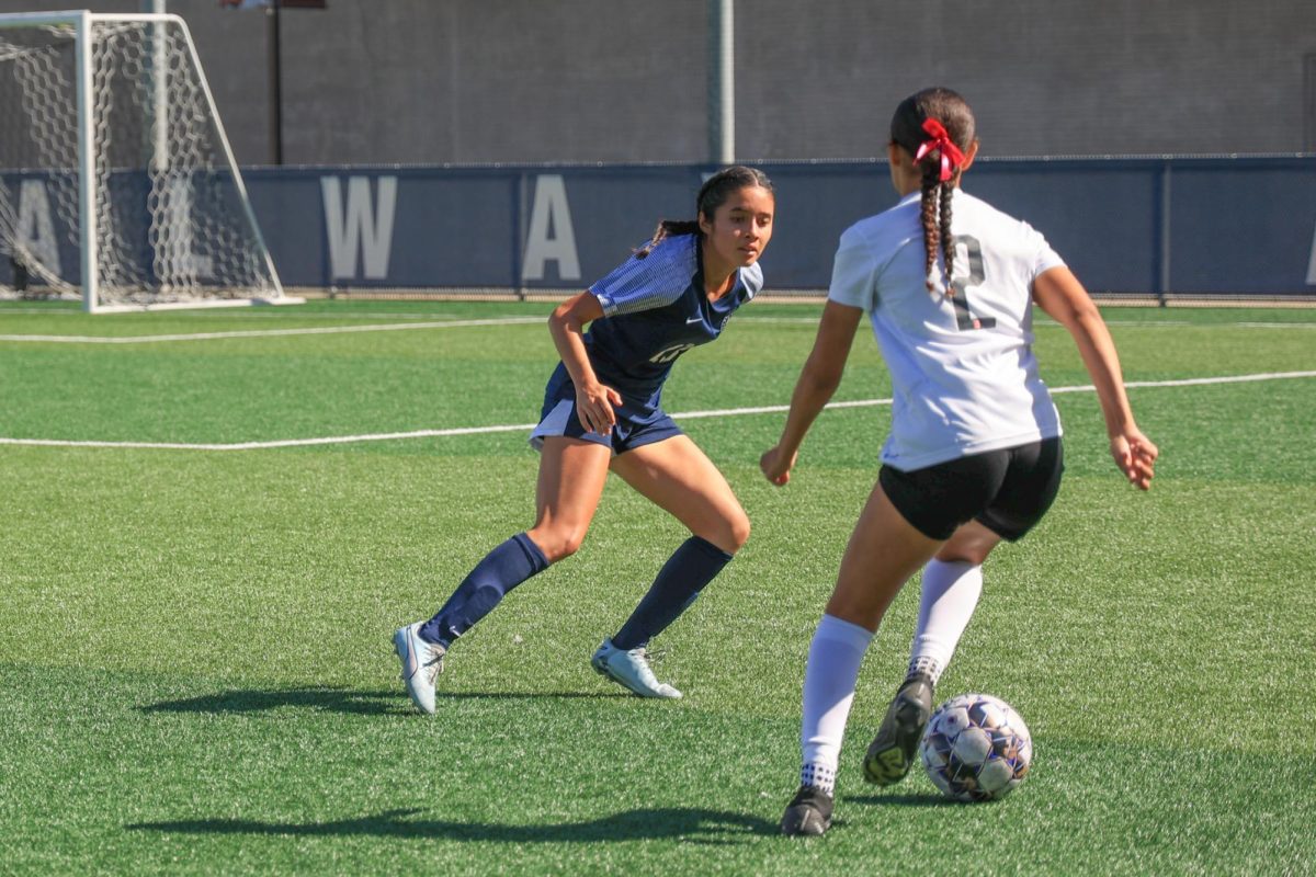 El Camino College Warriors defender Vanessa Lopez, left, challenges Long Beach City College Vikings midfielder Laila Alfadhiel for control of the ball on the ECC Soccer Field on Friday, Oct. 18. Lopez played in 17 games, drawing 12 starts and three assists last season. (Elsa Rosales | The Union)