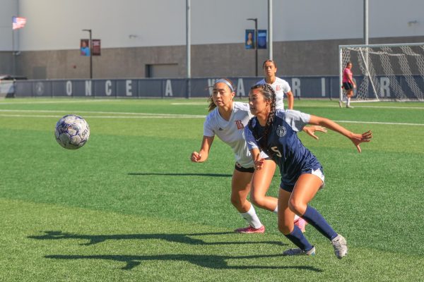 Long Beach City College Vikings defender/midfielder Samantha Soria (L) and El Camino College Warriors forward Julia Camacho race for control of the ball on the ECC Soccer Field on Friday, Oct. 18, 2024. The Warriors ended the Vikings' six-game winning streak with a tied score of 1–1. (Elsa Rosales | The Union)