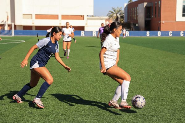 El Camino College Warriors forward Ashley Ruiz (L) races toward Long Beach City College Vikings midfielder Laura Vasquez on the ECC Soccer Field on Friday, Oct. 18, 2024. Ruiz was named to the 2023 All-South Coast Conference South First Team in November. (Elsa Rosales | The Union)