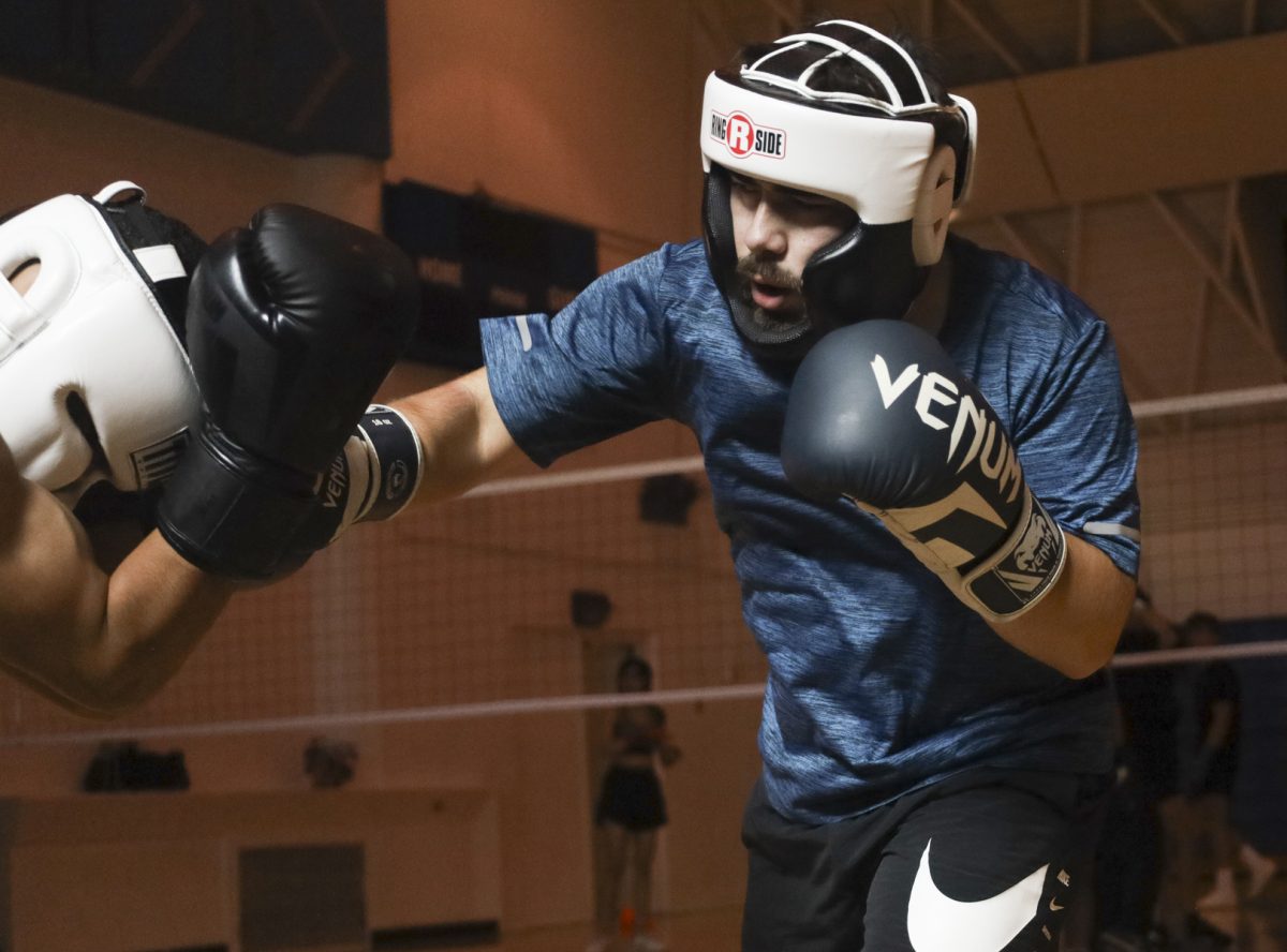 El Camino College Boxing Club members Christopher Munoz and club president Alec Rodriguez (right) spar during the a weekly meeting on Friday, Oct. 11. The Boxing Club will host an organized sparring event at Sweet Science Gym in Hawthorne on Tuesday, Nov. 26. (Mario Trejos | The Union)