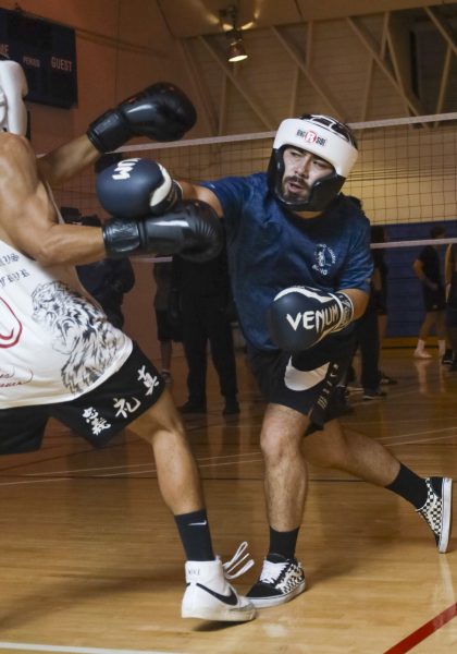 El Camino College Boxing Club members, from left, Christopher Munoz and club president Alec Rodriguez spar during the club's weekly meeting on Friday, Oct. 11, 2024. The club hosts their meetings every Friday from 10 a.m. to noon at the ECC South Gym. (Mario Trejos | The Union)