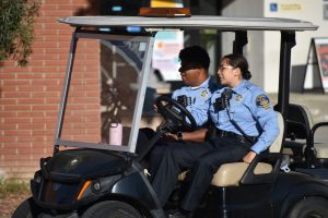 Two El Camino College police cadets patrol the Library Lawn on a golf cart on Wednesday, Sept. 11. (Elliott Bullock II | The Union)