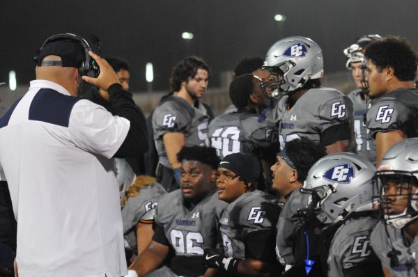 The Football coach runs plays and checks morale during one of the very first breaks of the game- Taheem Lewis