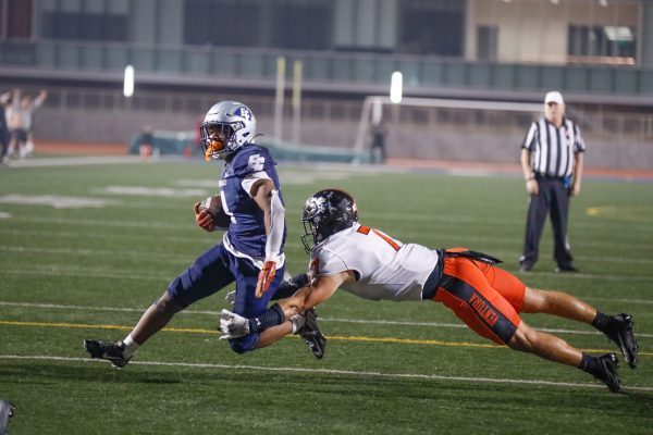 Warriors running back Jaden Moore runs into the end zone for a touchdown, evading a Ventura defender at Featherstone Field on Nov. 9. Moore and the Warriors clinched a playoff berth and a National Northern League title after taking down Ventura in a 45-38 comeback win over the Pirates. (Greg Fontanilla | The Union)