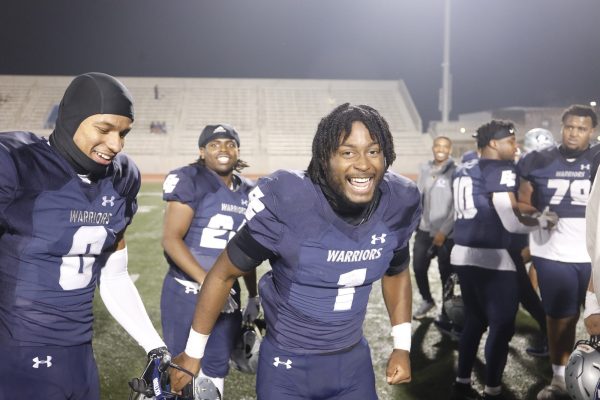 Defensive back Brett James, center, celebrates with his teammates at Featherstone Field on Nov. 9 after taking down the Ventura Pirates in a 45-38 comeback win, clinching a National Northern League title and a playoff berth. James and the Warriors will wrap up the regular season on the road on Nov. 16 to face Allan Hancock. (Greg Fontanilla | The Union)